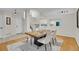 Open-concept dining room with updated fixtures and lots of natural light at 1717 Tulip St, Longmont, CO 80501