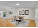 Bright dining room featuring light wood floors and a statement rug at 1717 Tulip St, Longmont, CO 80501