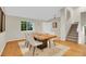 Well-lit dining area showcasing neutral tones and access to the staircase at 1717 Tulip St, Longmont, CO 80501