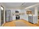 Bright kitchen with stainless steel appliances and contemporary white cabinets at 1717 Tulip St, Longmont, CO 80501