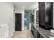 Elegant bathroom with granite countertop, modern vanity, and glass shower at 1804 Little Raven St, Denver, CO 80202