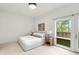 Bright bedroom with a comfortable bed and access to a balcony at 1804 Little Raven St, Denver, CO 80202
