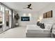 Spacious bedroom with a king-size bed, ceiling fan, and access to balcony at 1804 Little Raven St, Denver, CO 80202