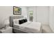 Spacious bedroom with a gray platform bed and private access to a patio at 1804 Little Raven St, Denver, CO 80202