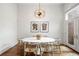 Bright dining area with a round table and modern chairs, hardwood floors at 1804 Little Raven St, Denver, CO 80202