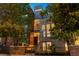 Modern three-story townhome with a sleek design and a fenced front yard at 1804 Little Raven St, Denver, CO 80202