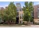 Contemporary townhome, featuring a multi-level design and a tree-lined street at 1804 Little Raven St, Denver, CO 80202