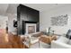 Living room with a large modern fireplace and hardwood floors at 1804 Little Raven St, Denver, CO 80202