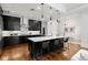 Modern kitchen with dark cabinetry, stainless steel appliances, and an island at 1804 Little Raven St, Denver, CO 80202