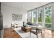 Bright living room with hardwood floors, large windows, and stylish furniture at 1804 Little Raven St, Denver, CO 80202