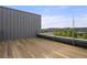 Spacious rooftop deck with wood flooring and city views at 1804 Little Raven St, Denver, CO 80202