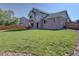 Expansive backyard featuring a well-maintained lawn and a patio perfect for outdoor entertaining at 2195 S Espana St, Aurora, CO 80013