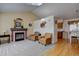 Cozy living room featuring a fireplace, vaulted ceilings, and stylish decor at 2195 S Espana St, Aurora, CO 80013