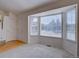 Bright living room with hardwood floors, a bay window, and lots of natural light at 2195 S Espana St, Aurora, CO 80013