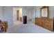 Spacious main bedroom showing view into bathroom with dual sinks and walk-in shower at 2195 S Espana St, Aurora, CO 80013