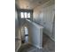 Carpeted staircase with white trim and doors, illuminated by natural light from nearby windows at 7360 Watercress Dr, Littleton, CO 80125