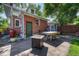 Backyard patio with a fire pit, barbecue, and dining area at 3779 Quitman St, Denver, CO 80212