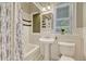 Charming bathroom features subway tile, a shower-tub combo, and stylish fixtures at 3779 Quitman St, Denver, CO 80212