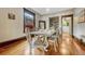 Dining room with hardwood floors, modern lighting, and view into kitchen at 3779 Quitman St, Denver, CO 80212