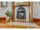 Close up of decorative fireplace with tile surround and wooden mantle at 3779 Quitman St, Denver, CO 80212