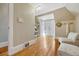Hallway with wood floors, neutral walls, and stylish seating at 3779 Quitman St, Denver, CO 80212