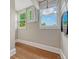 Landing with exposed beams, new wood floors, and two windows overlooking the exterior at 3779 Quitman St, Denver, CO 80212