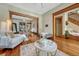 Open living room with hardwood floors, seamless flow to dining, and decorative bench at 3779 Quitman St, Denver, CO 80212