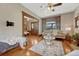Bright living room featuring hardwood floors, large windows, and decorative seating at 3779 Quitman St, Denver, CO 80212