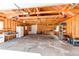 Large garage with exposed wood frame and room for workshop at 2061 E Floyd Ave, Englewood, CO 80113