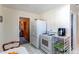 Functional kitchen with essential appliances, adjacent dining area, and access to other living spaces at 2061 E Floyd Ave, Englewood, CO 80113