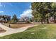 Community playground with play structures and lots of green space at 2061 E Floyd Ave, Englewood, CO 80113