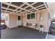 Cozy covered porch with seating, perfect for relaxing and enjoying the outdoors at 2061 E Floyd Ave, Englewood, CO 80113