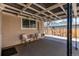 Charming covered porch featuring outdoor seating with decor at 2061 E Floyd Ave, Englewood, CO 80113