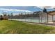 Community tennis court surrounded by green space and residential buildings at 2061 E Floyd Ave, Englewood, CO 80113
