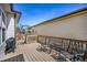 Spacious deck with dark composite decking and seating area for backyard views at 1481 Red Poppy Way, Brighton, CO 80601
