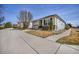 Charming single-story home featuring a well-maintained front yard and attached two-car garage at 1481 Red Poppy Way, Brighton, CO 80601