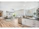 Open-concept living space featuring a kitchen, dining area, and comfortable living room at 1481 Red Poppy Way, Brighton, CO 80601