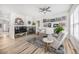 Inviting living room with a fireplace, neutral decor, wood flooring, and stylish accents at 1481 Red Poppy Way, Brighton, CO 80601