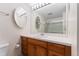 Bright bathroom featuring a spacious vanity, large mirror, and a shower-tub combination at 12408 E Ohio Ave, Aurora, CO 80012