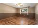 Comfortable bedroom featuring hardwood floors and a window, ready for customization at 12408 E Ohio Ave, Aurora, CO 80012