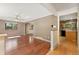 Inviting living area with hardwood floors, ceiling fan, and natural light at 12408 E Ohio Ave, Aurora, CO 80012