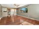 Cozy living room with hardwood floors, ceiling fan, and ample lighting at 12408 E Ohio Ave, Aurora, CO 80012