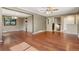 Open-concept living area featuring hardwood floors and neutral paint at 12408 E Ohio Ave, Aurora, CO 80012