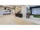 Finished basement featuring decor, wet bar, and golf simulator at 13812 Honey Hush Trl, Parker, CO 80134