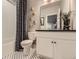 Elegant bathroom features a marble-look floor, new toilet, and modern vanity at 13812 Honey Hush Trl, Parker, CO 80134