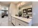 Modern bathroom with a dual sink vanity, quartz countertops, and a lovely design at 13812 Honey Hush Trl, Parker, CO 80134