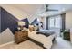 Comfortable bedroom featuring designer paint, neutral carpeting, and a window with natural lighting at 13812 Honey Hush Trl, Parker, CO 80134