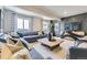 Modern living room with decorative paneling and comfortable furniture at 13812 Honey Hush Trl, Parker, CO 80134
