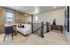 Comfortable loft featuring designer decor, neutral carpeting, and a wooden accent wall at 13812 Honey Hush Trl, Parker, CO 80134