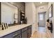 Inviting mudroom features custom millwork, quartz countertops, and a view of the connected laundry area at 13812 Honey Hush Trl, Parker, CO 80134